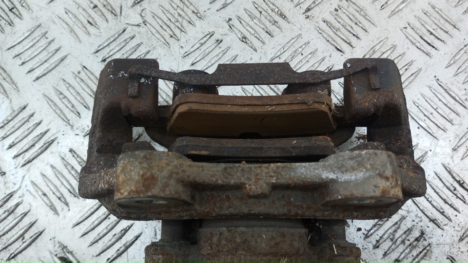 Суппорт задний левый