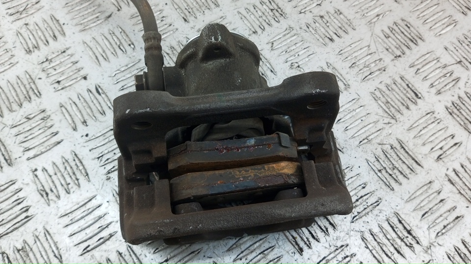 Суппорт задний левый