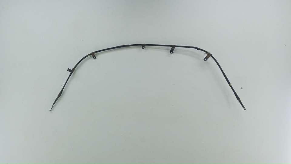 Трос стояночного тормоза левый