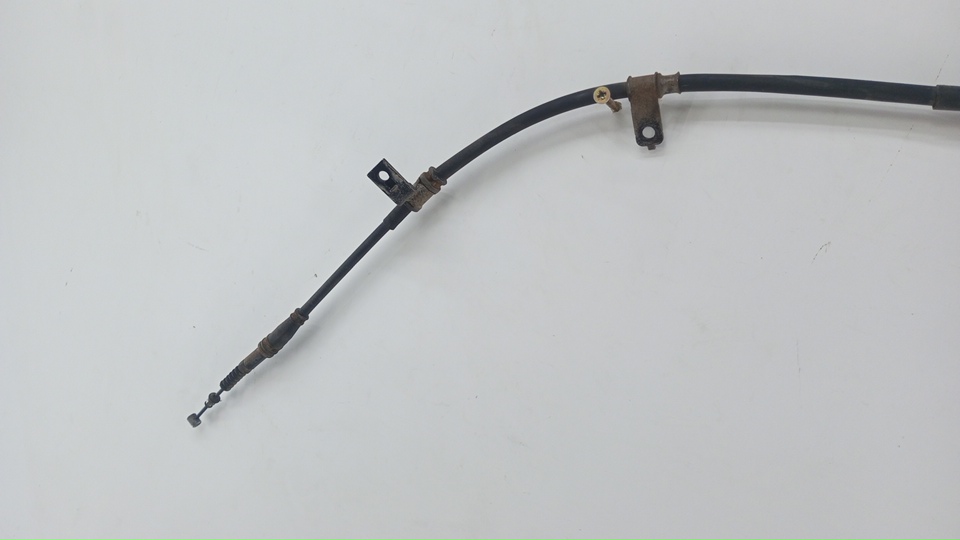 Трос стояночного тормоза левый