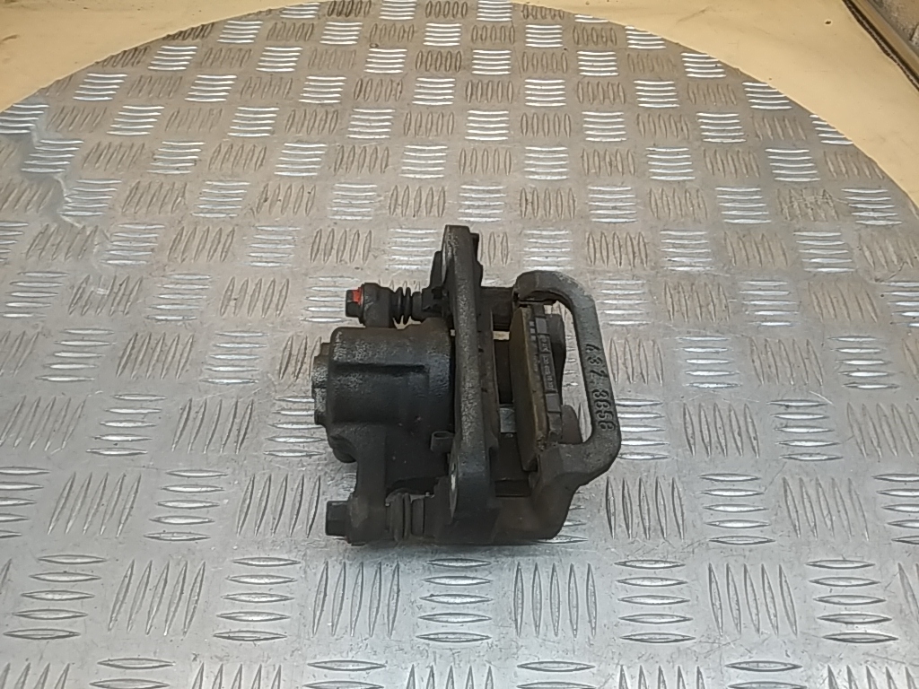 Суппорт задний левый