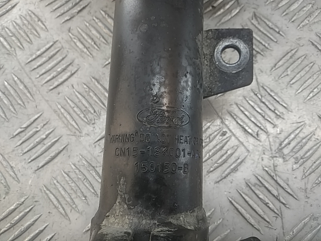 Амортизатор передний левый