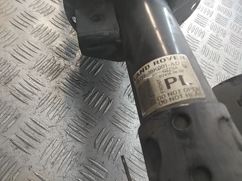 Амортизатор передний левый