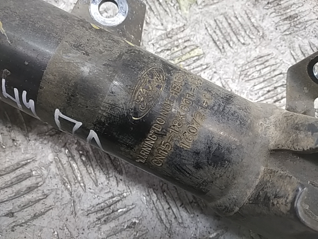 Амортизатор передний левый