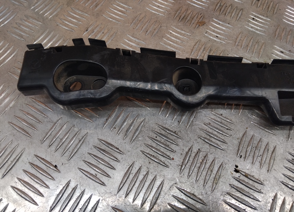 Кронштейн заднего бампера левый