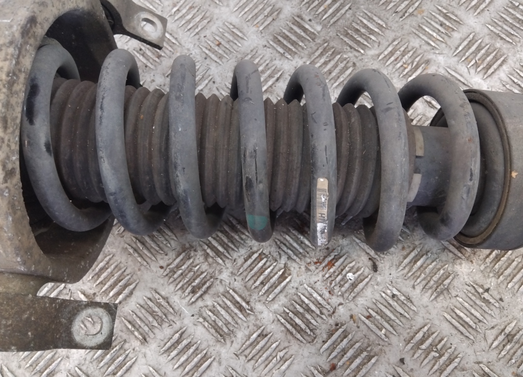Пружина задняя
