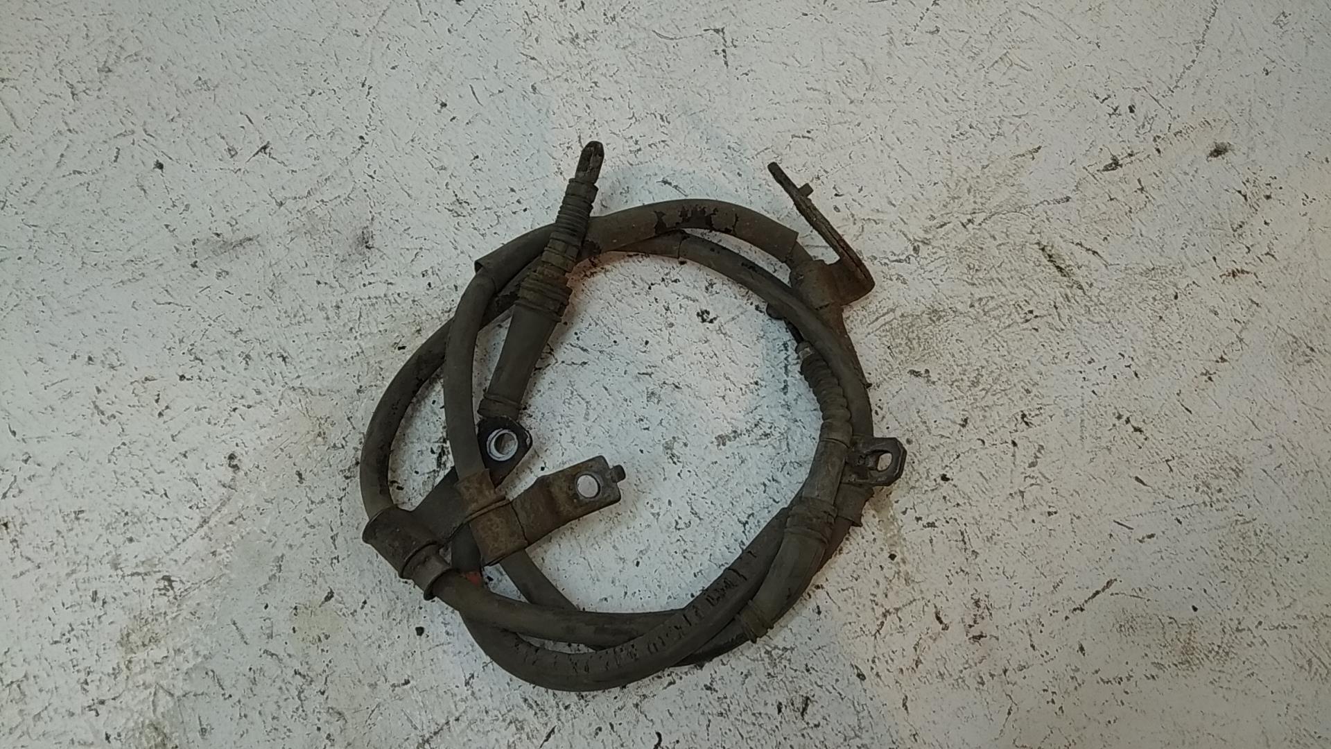 Трос стояночного тормоза левый