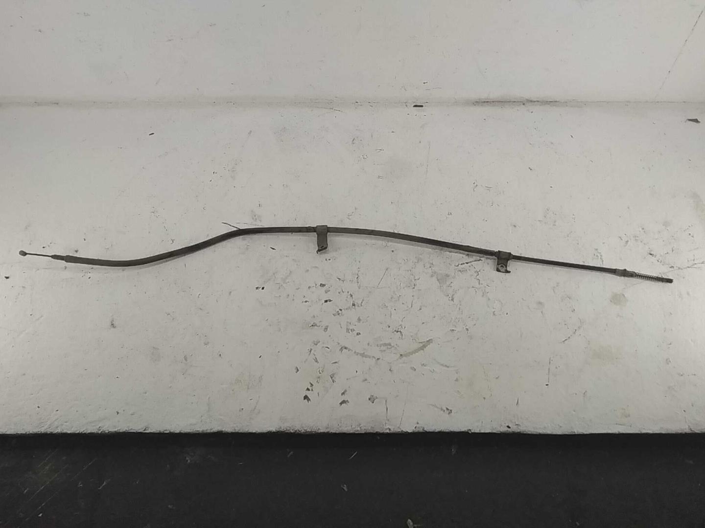 Трос стояночного тормоза левый